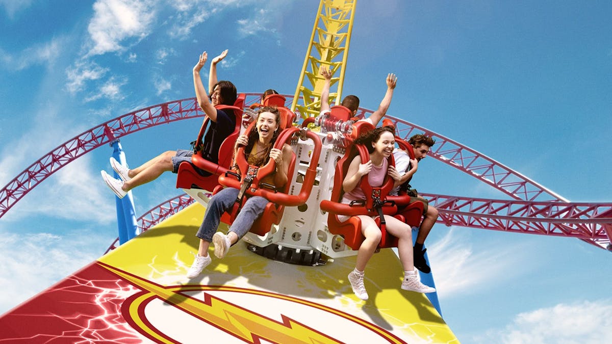 gold-coast-attractions thrill-seekers enjoying a high-speed roller coaster at warner bros movie world, one of the top gold coast attractions